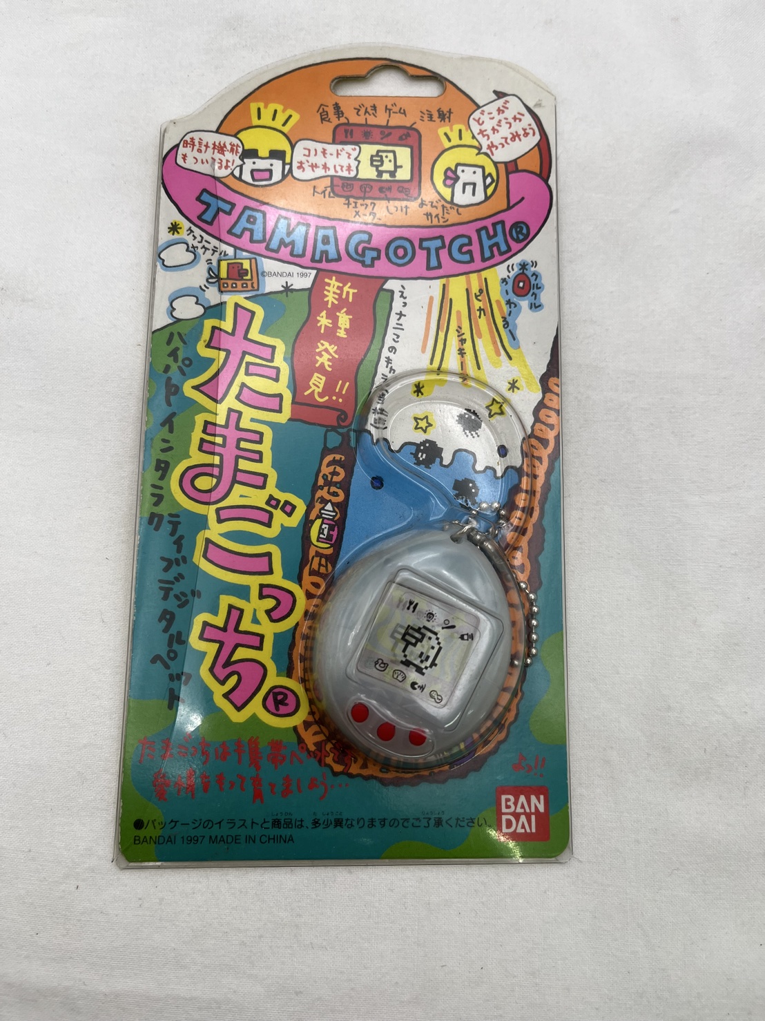 ▽未使用品 BANDAI バンダイ たまごっち 新種発見！！ クリアホワイト